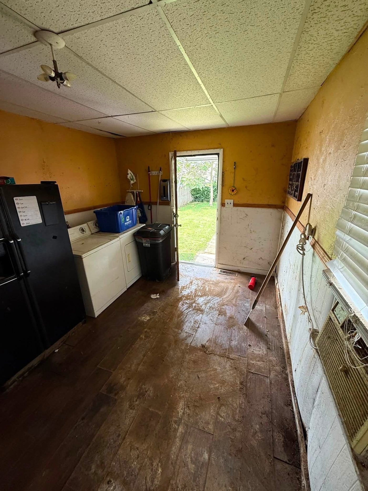 Same mudroom cleared of clutter after a cleanout